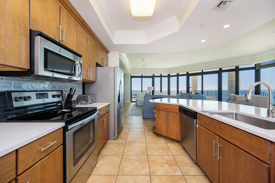 Craft delectable meals in your kitchen as the calm coast vibes flow in, enhancing your culinary experience