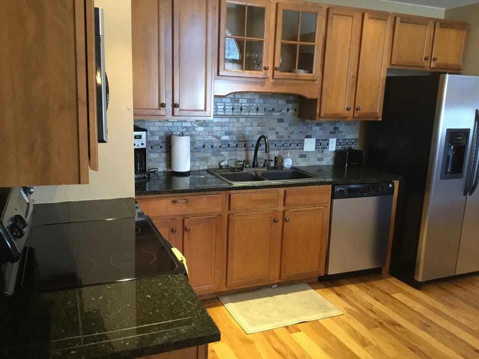 coffeemaker, toaster, fridge with ice maker, microwave, range, paper towels, etc