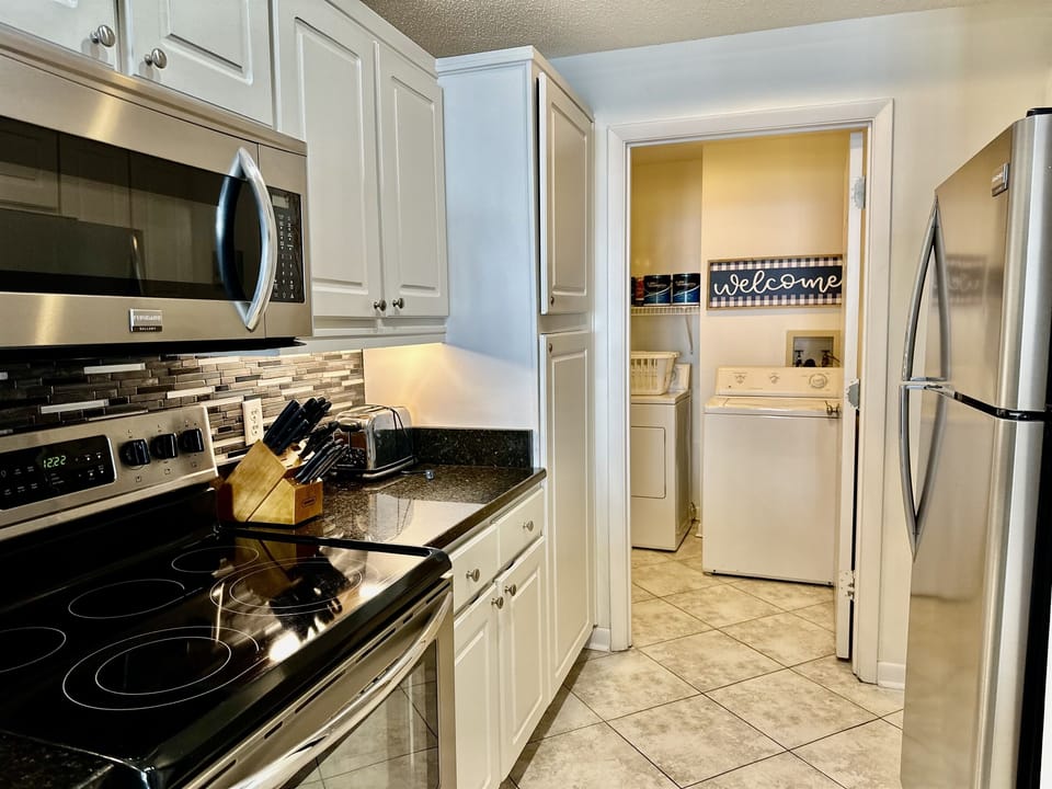 Laundry room is right behind the kitchen!