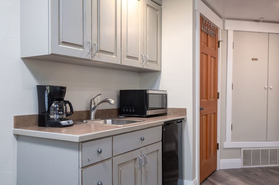 Mini fridge, microwave, toaster oven, and coffee maker