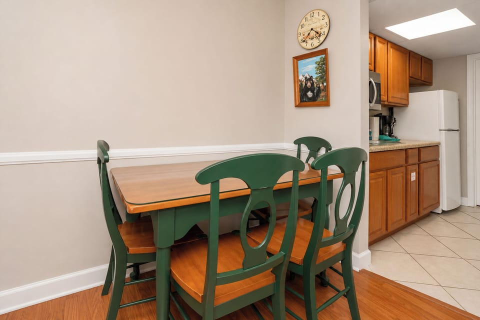 Your dining area is ready for home-cooked meals and morning coffee. The adjacent kitchen offers everything you need to prepare your favorite dishes in comfort.