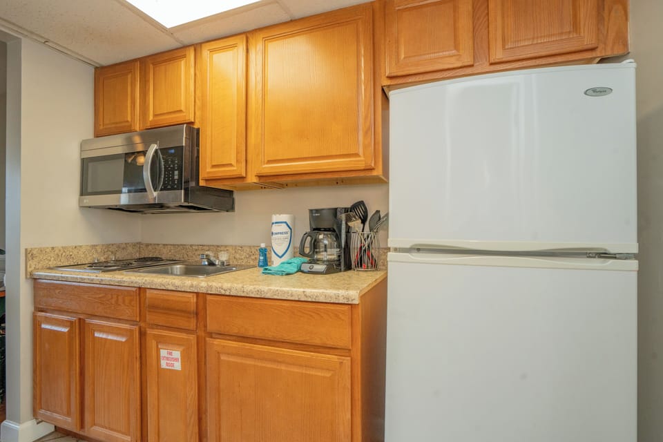 Your convenient kitchenette includes a refrigerator, microwave, and coffee maker—everything you need to feel right at home during your stay.