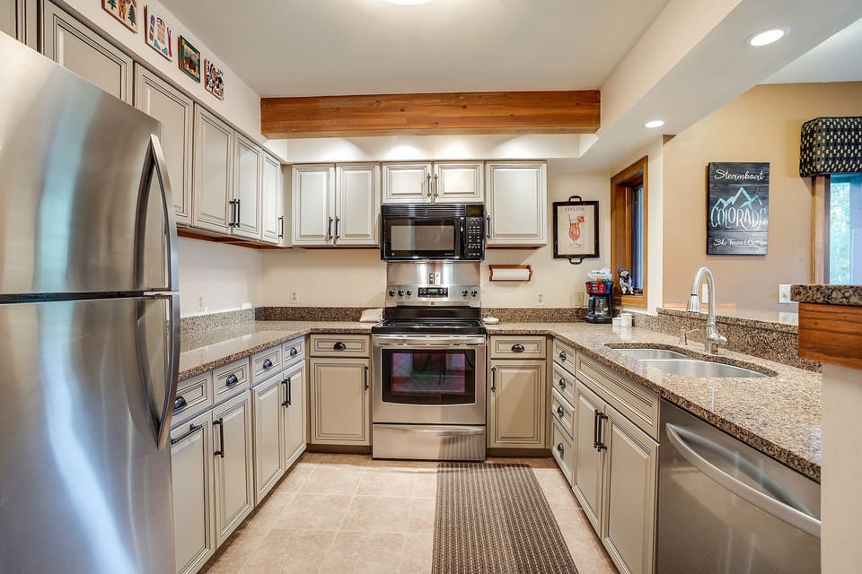Your fully equipped kitchen features granite countertops, stainless steel appliances, and everything you need to create memorable meals during your stay.