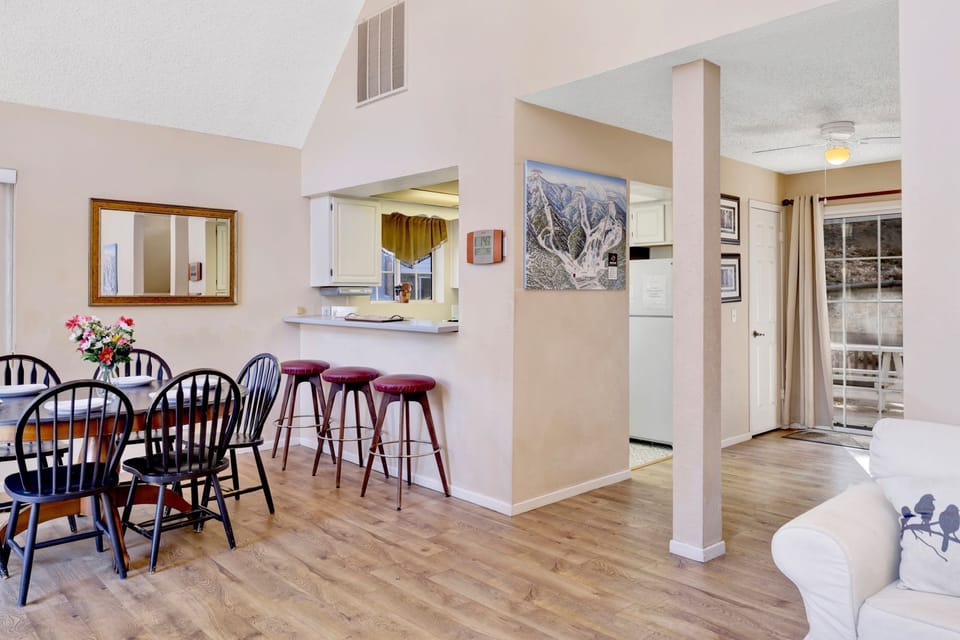 Living room view with natural light and scenic backdrop, perfect for relaxing and unwinding