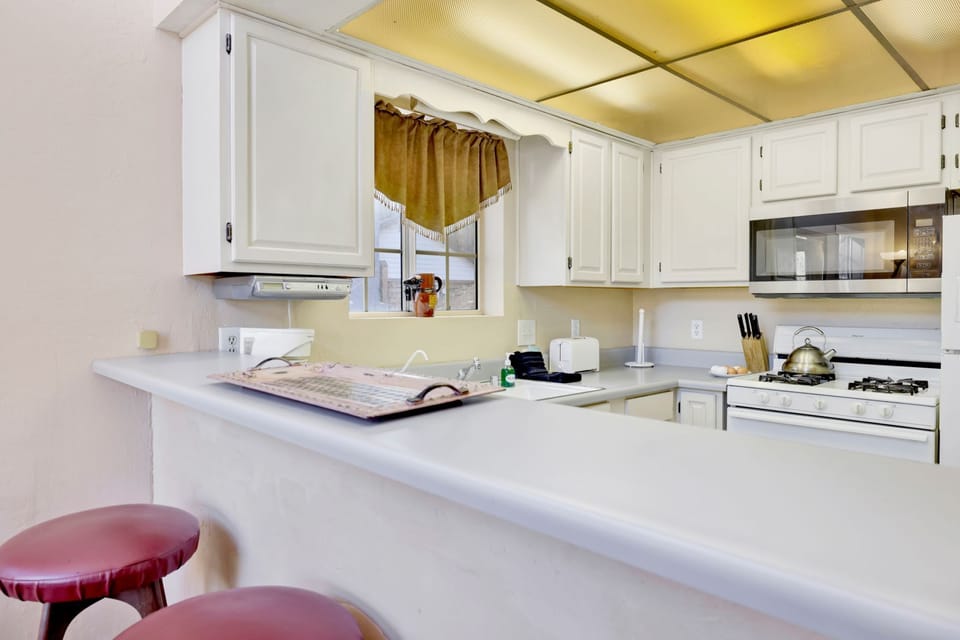 Open kitchen view from dining area, showcasing modern appliances and inviting design