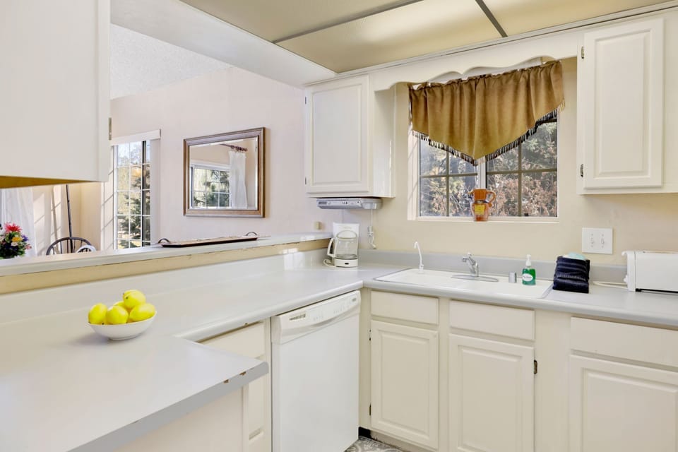 Modern kitchen with full amenities, spacious layout, and inviting design for shared meals