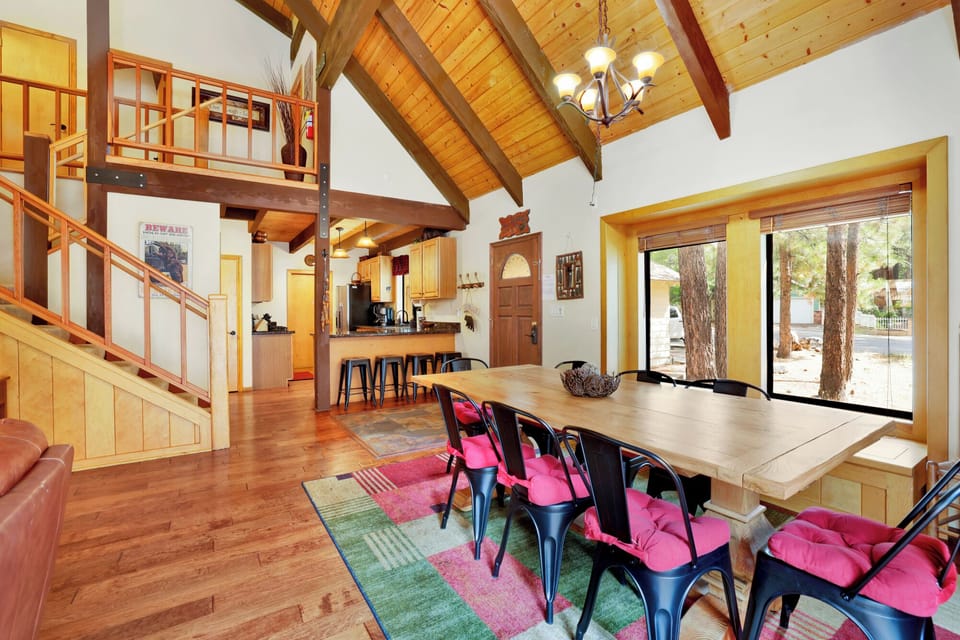Fully equipped cabin kitchen with wood cabinets, stove, fridge, microwave, and coffee maker—perfect for cooking meals, morning coffee, and feeling right at home on your stay.