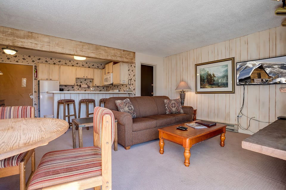 Cozy up in your mountain retreat with a full kitchen, comfortable seating, and rustic charm.