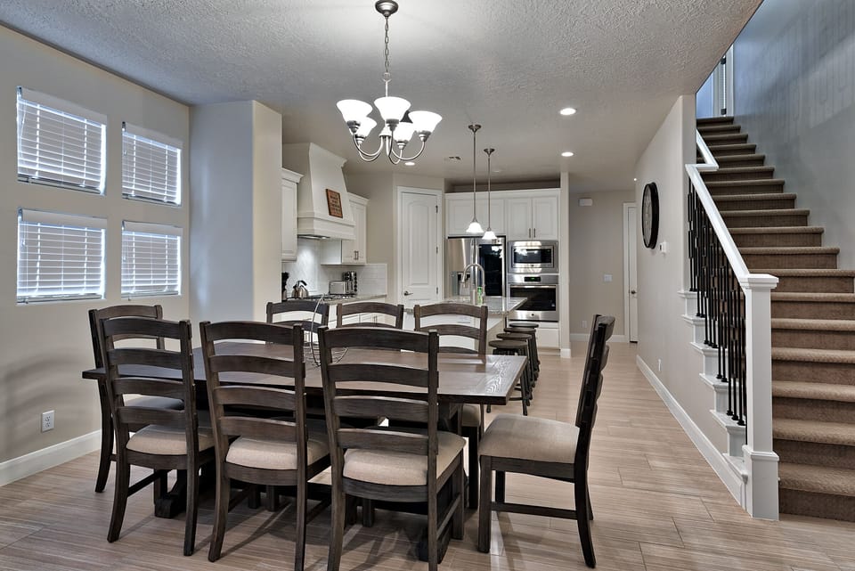 Dining Table & Kitchen View - Share memories and stories while enjoying a family style meal around the Dining Table.