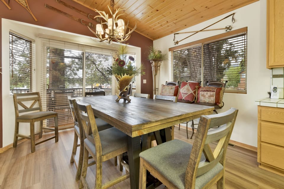 Fully equipped cabin kitchen with beautiful wood cabinets, stove, fridge, microwave, and coffee maker—perfect for cooking meals, morning coffee, and feeling right at home on your stay.