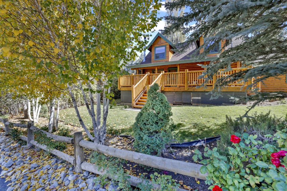 Welcoming cabin entry surrounded by towering pine trees, offering fresh mountain air and a peaceful forest setting—the perfect first impression for your Big Bear Lake getaway.