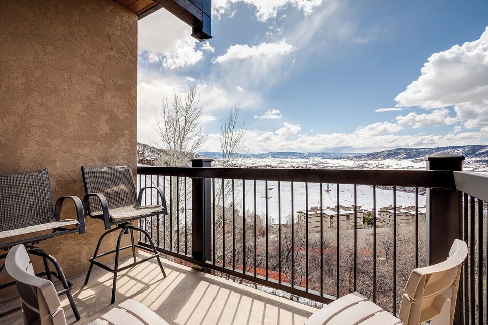 Step onto your private balcony and breathe in crisp mountain air while taking in sweeping winter valley views.
