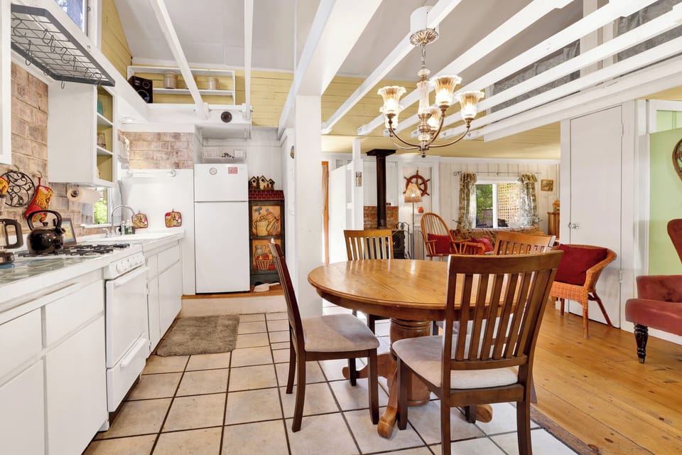 Fully equipped cabin kitchen with ample cabinetry, stove, fridge, and coffee maker—perfect for cooking meals, morning coffee, and feeling right at home on your stay.