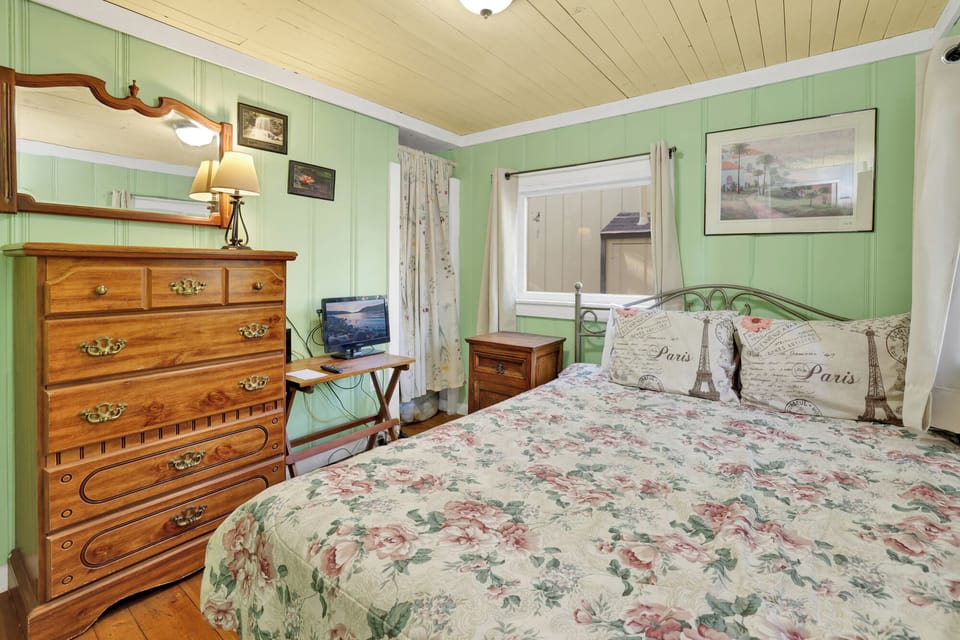 Peaceful cabin bedroom with plush bedding, and beautiful views—ideal for restful nights, cozy mornings, and a relaxing mountain escape.