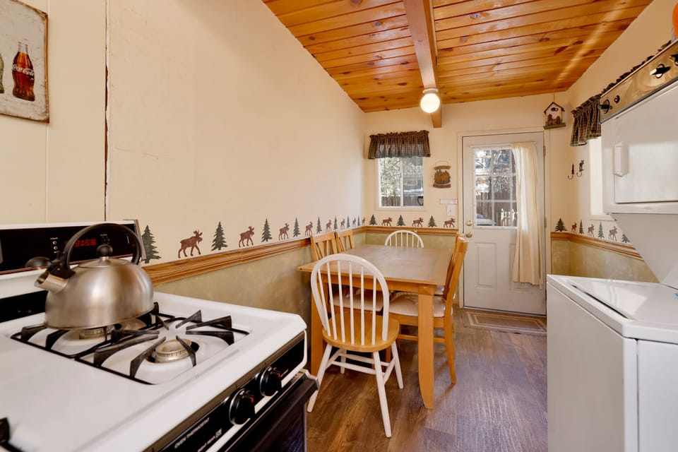 Dining area with seating for 4, perfect for cozy meals and shared conversations.