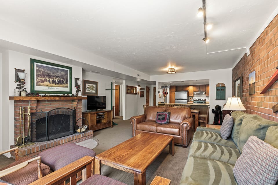 Park Station 121 has a living room with comfortable furnishings and wood burning fireplace.