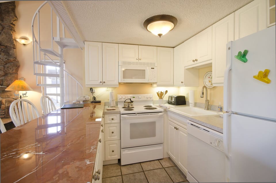 Your bright, fully-equipped kitchen features marble countertops and everything you need to prepare memorable meals during your stay.
