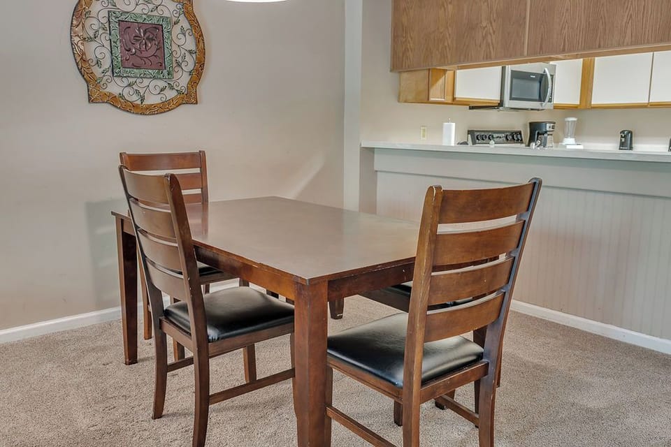 Dinning area - This convenient pass through counter in the kitchen is so handy for serving that first cup of coffee to start your day.