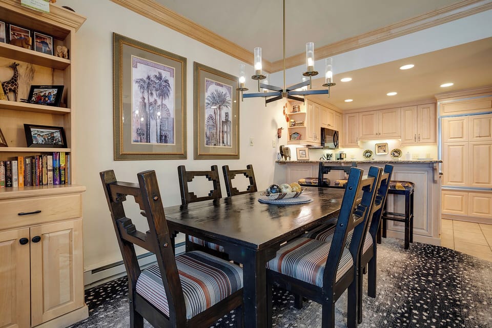 Gather around this elegant dining table where your group can share meals and make memories together in this beautifully appointed space.