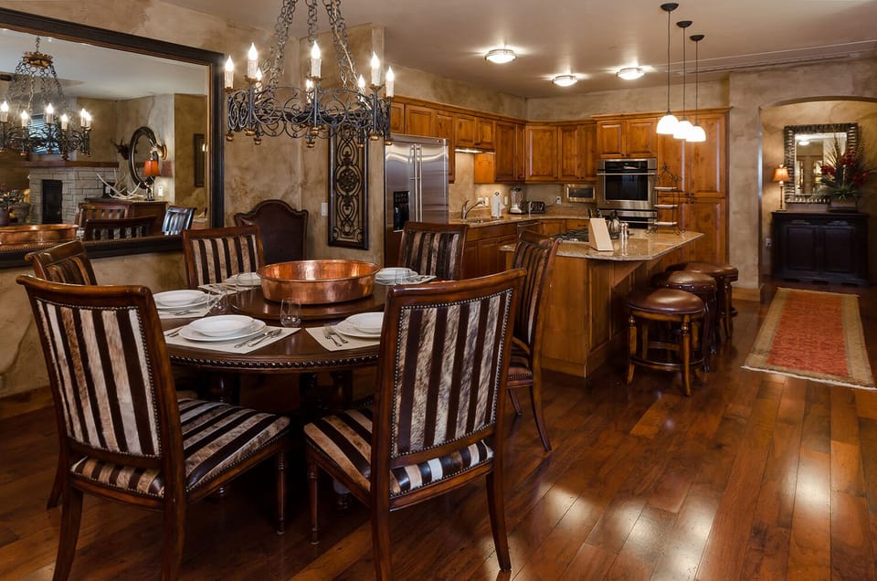 Your elegant dining space features rich wood tones and warm lighting, perfect for memorable meals with loved ones.