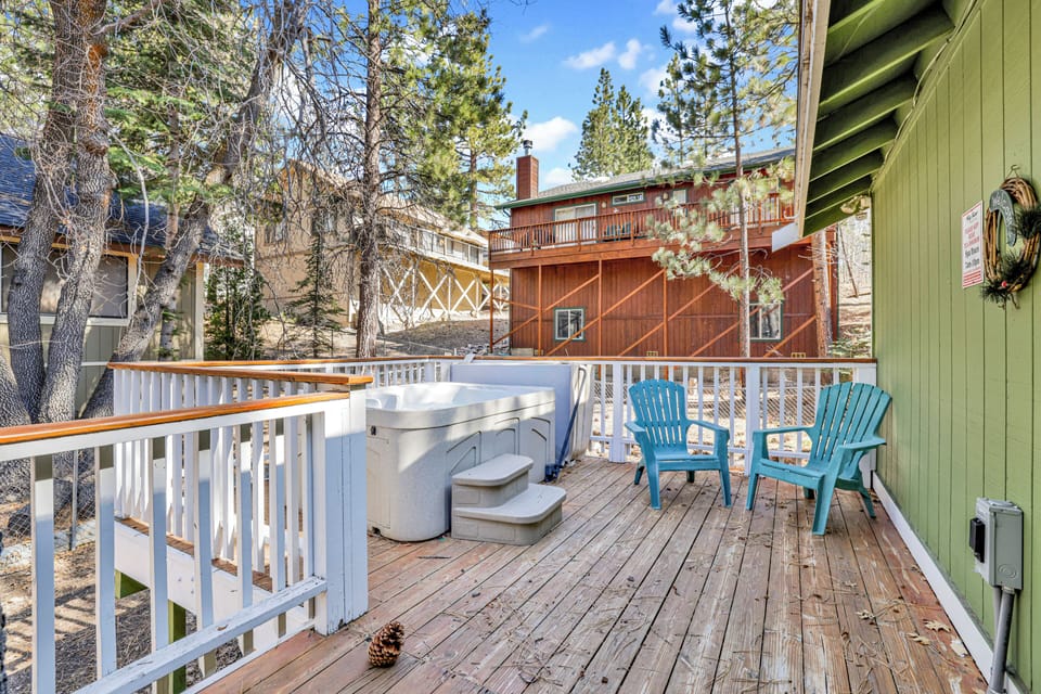 Private outdoor hot tub surrounded by tall pines, perfect for relaxing under the trees after a day of adventure—enjoy peaceful forest views, fresh air, and a truly rejuvenating stay.