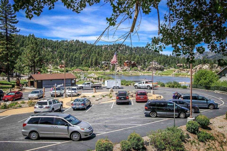 Enjoy beautiful views of the nearby lake and lush mountain landscape right from the property. This vantage point showcases the prime location, offering a serene backdrop for your stay.