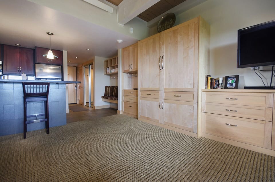 Relax in this bright open space where warm wood finishes and modern amenities create your perfect home-away-from-home retreat.