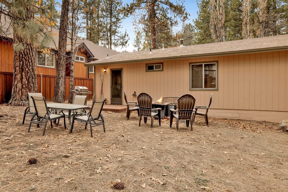 Private outdoor BBQ  surrounded by tall pines, perfect for relaxing under the trees after a day of adventure—enjoy peaceful forest views, fresh air, and a truly rejuvenating stay.