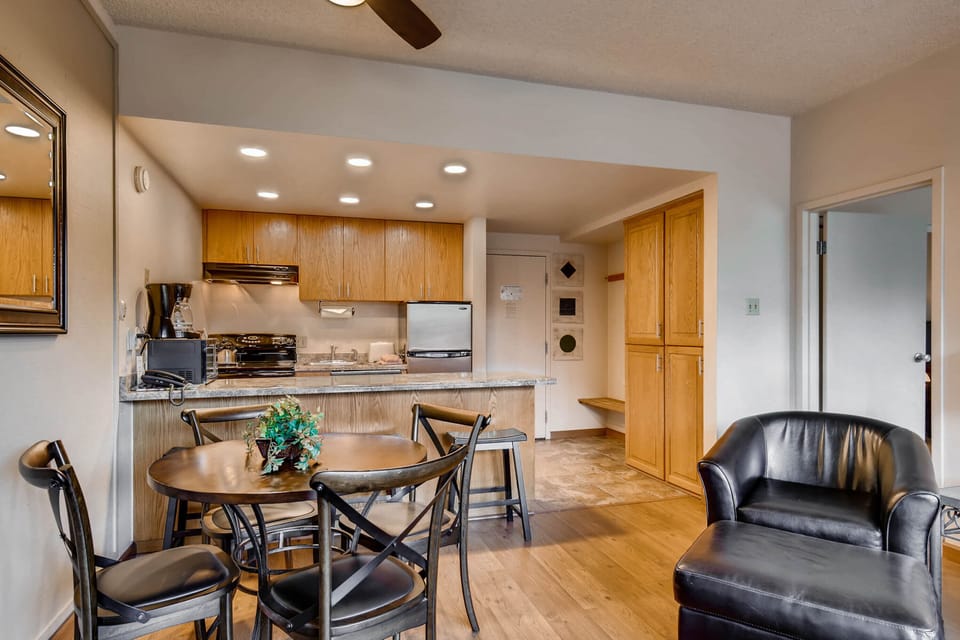 Comfortable open concept kitchen, dining, and living room.