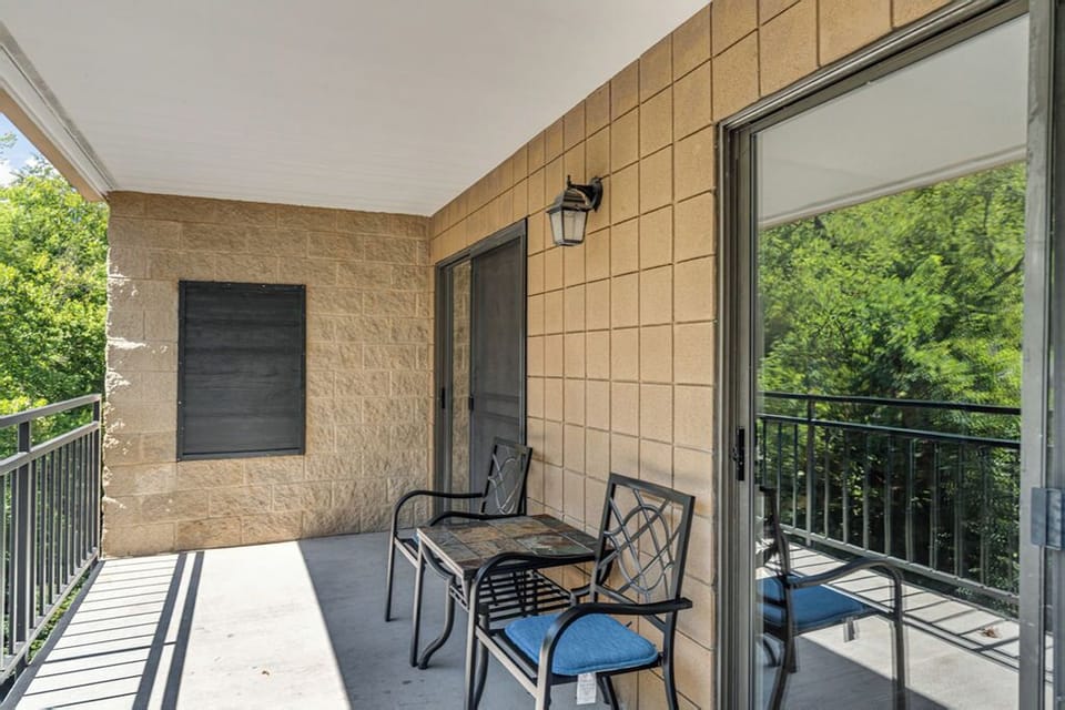 spacious private balcony over the river - Unwind on the oversized balcony that spans from the family room to the master suite, offering a serene view of the river that flows just below.