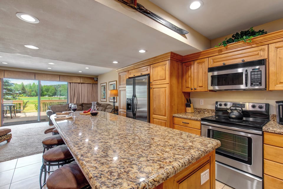 The kitchen has stainless steel appliances.