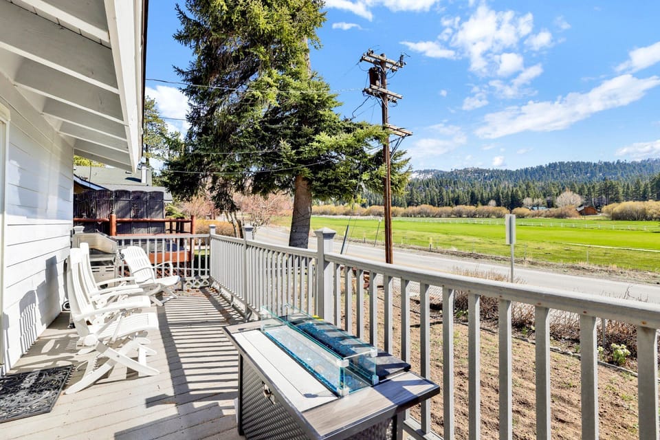 Private outdoor deck surrounded by tall pines, perfect for relaxing under the trees after a day of adventure—enjoy peaceful forest views, fresh air, and a truly rejuvenating stay.