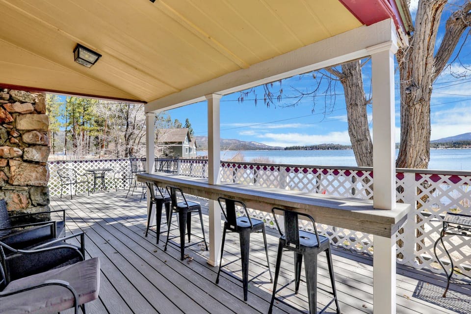 Private outdoor deck with comfortable seating and a BBQ, surrounded by tall pines, perfect for relaxing under the trees after a day of adventure—enjoy peaceful forest views, fresh air, and a truly rejuvenating stay.