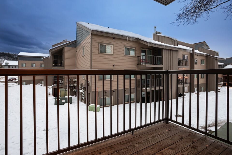 Step onto your private balcony and breathe in the crisp mountain air while taking in views of the snow-covered landscape.