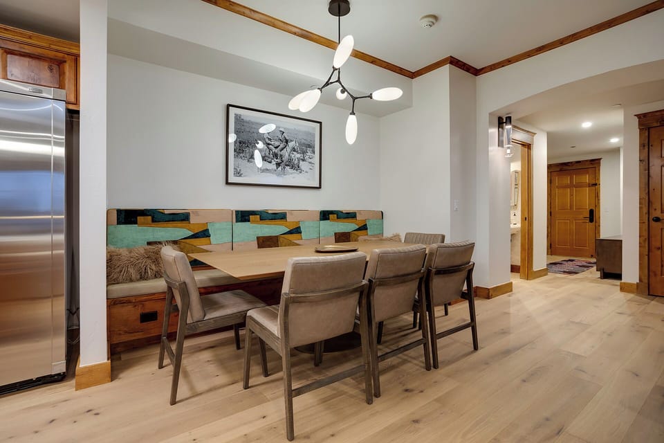 Gather around this stylish dining table where memorable meals and conversations await in your mountain retreat.