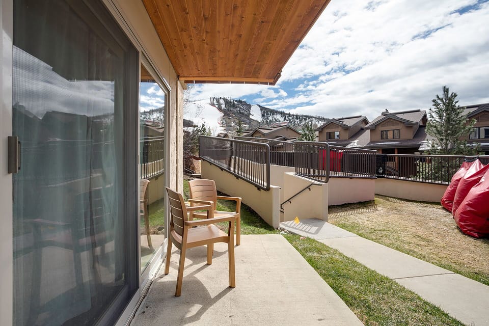 Step onto your private terrace where mountain views and comfortable seating create the perfect spot for morning coffee or evening relaxation.