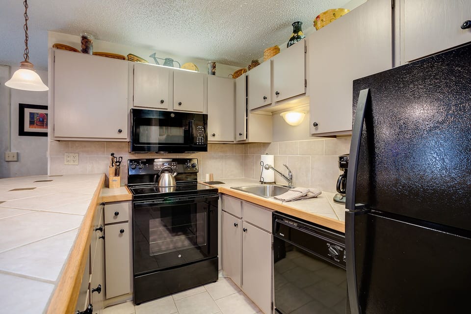 Cook your favorite meals in this well-equipped kitchen with full-size appliances and ample counter space for your culinary adventures.