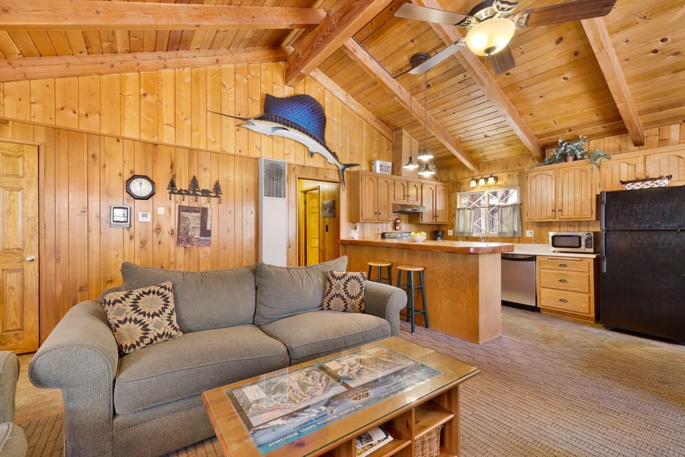 Bright living room with fireplace and room for games, blending comfort and entertainment