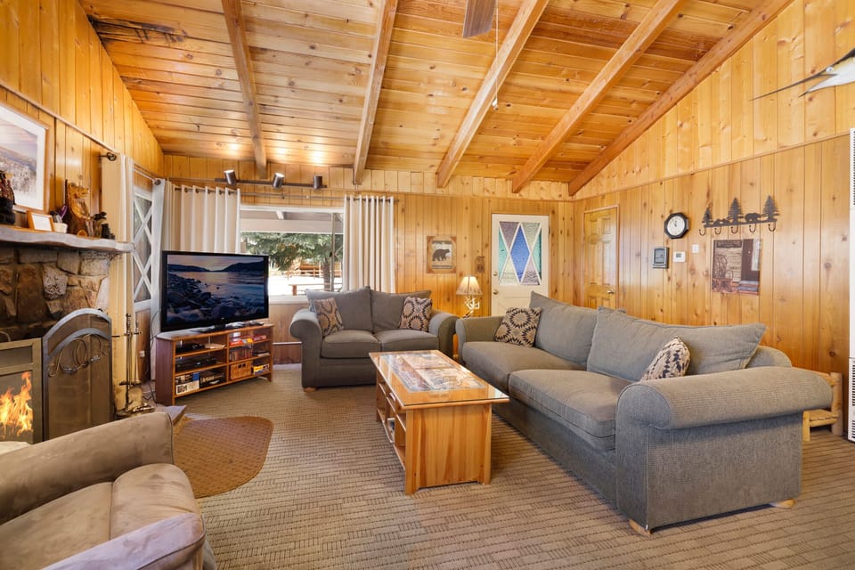 “Inviting living room with fireplace and open layout, ideal for family fun and play
