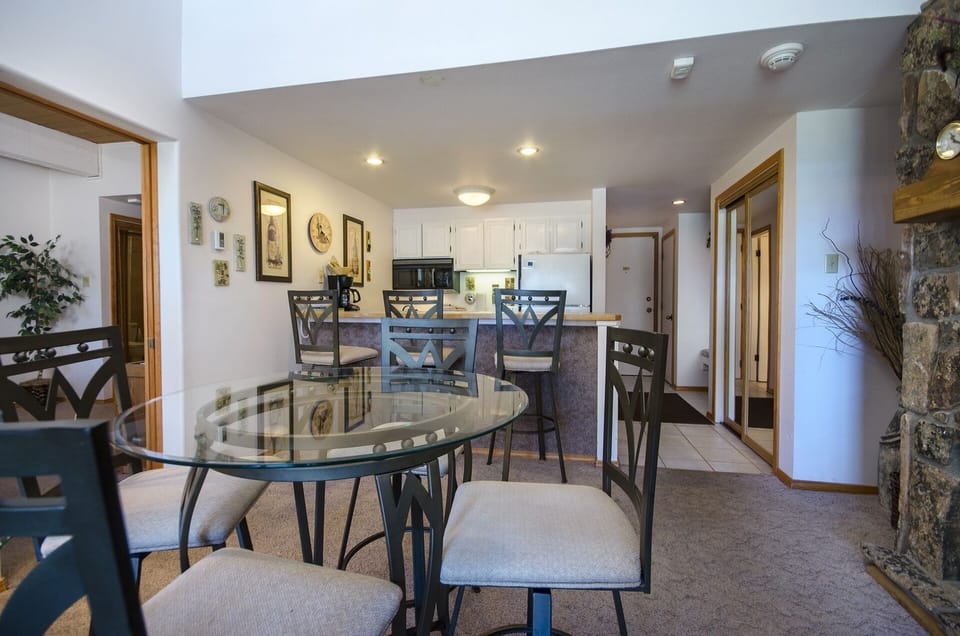Gather around your spacious glass dining table for memorable meals, with a fully equipped kitchen ready for culinary adventures.