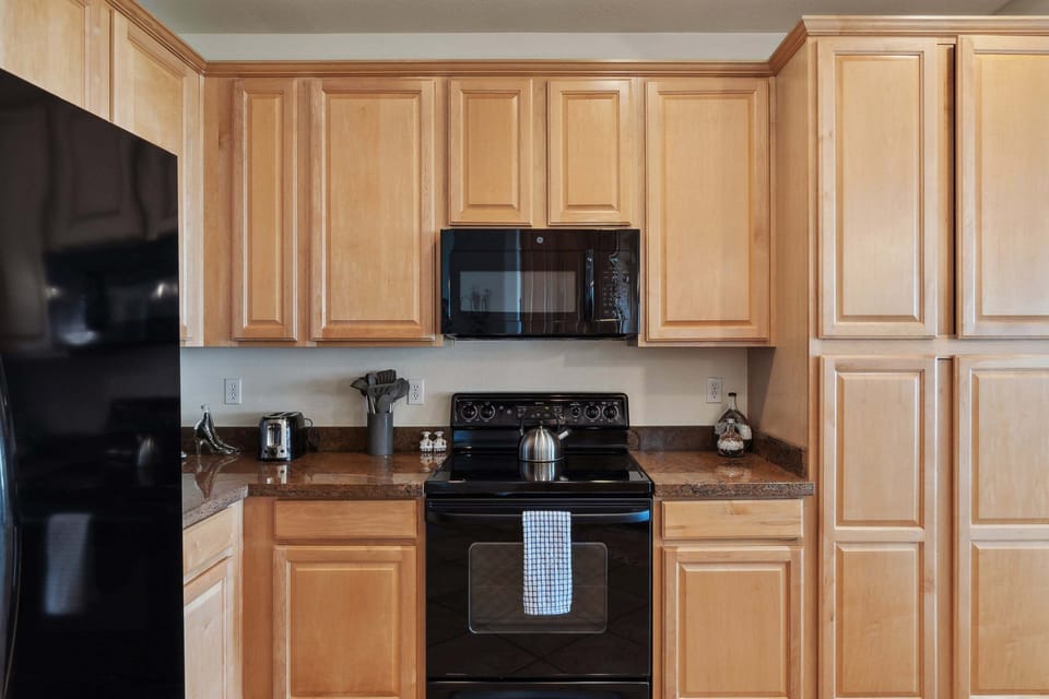Electric stove and plenty of cabinets!