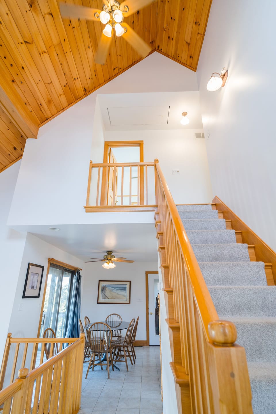 Up the open staircase to two bedrooms, Sundeck, Balcony, & a full bath.