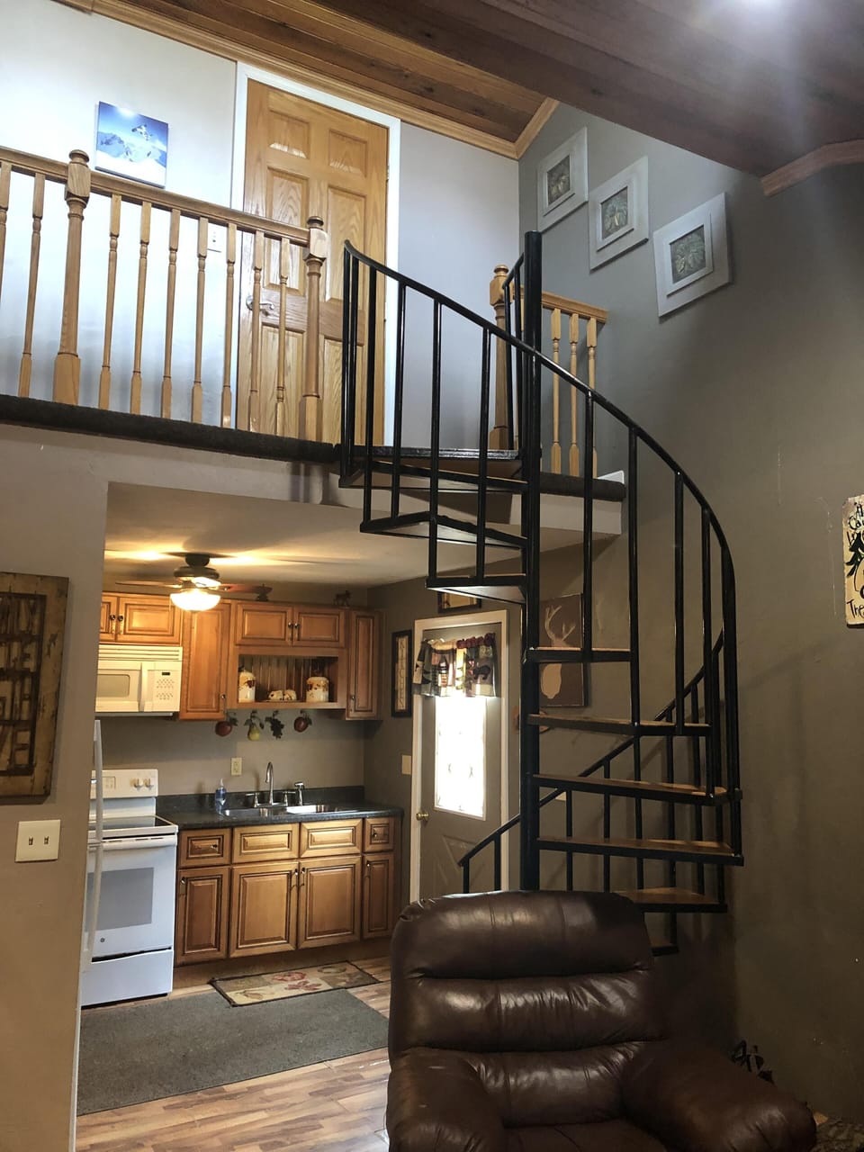 Kitchen and Spiral staircase to 2 upstairs bedrooms.