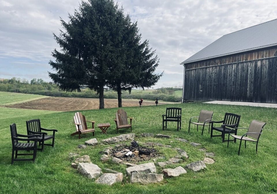 Enjoy the view and open fire pit in front of the classic bank barn.