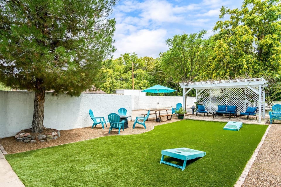 Fun backyard corn hole, ping pong, lots of seating and a propane fire pit