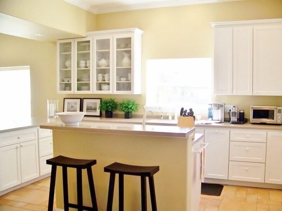 Double tiered kitchen island with additional sink