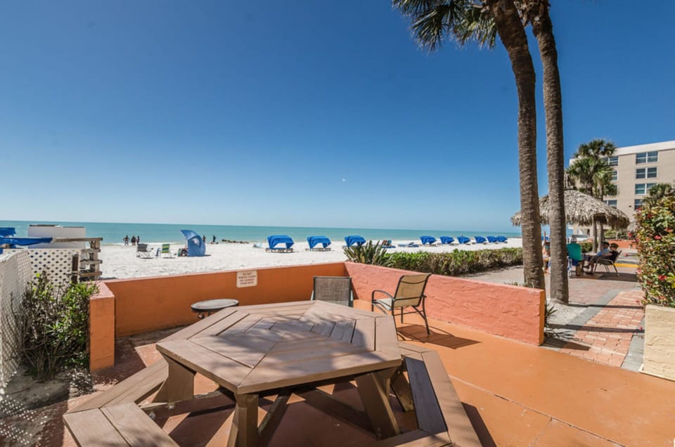 Refreshing heated pool overlooks the beach!  Perfect space to lounge or suntan! 