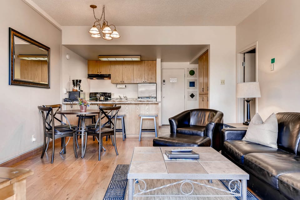 Comfortable open concept kitchen, dining, and living room.