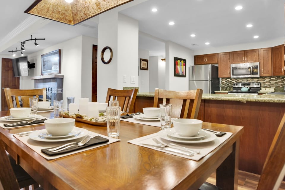 Park Station 113 has a wood dining table, six wood chairs and place settings for 6.