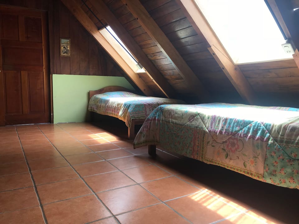 Upstairs Sleeping Loft with Two Singles, Fans, Skylights, No AC